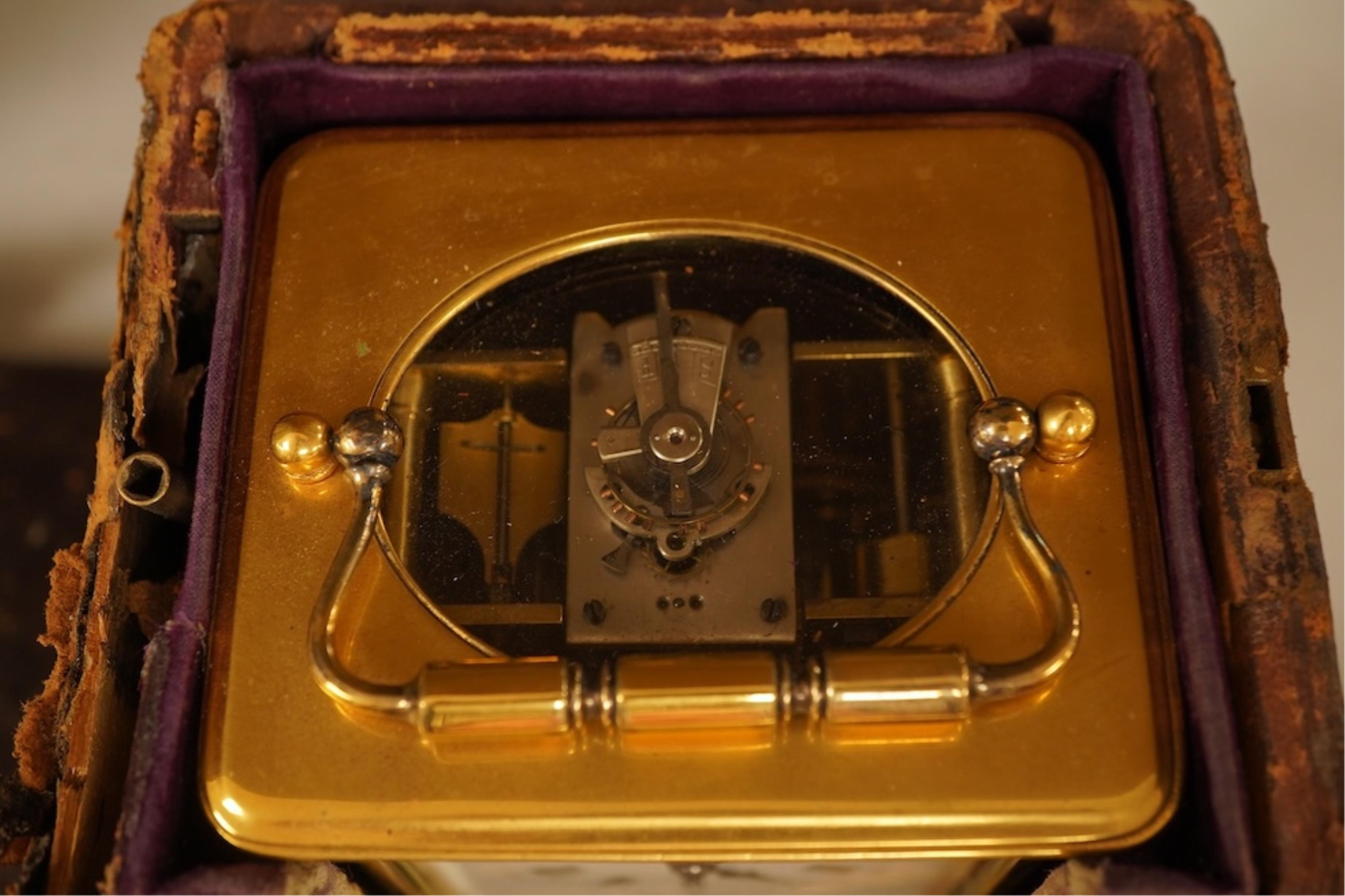 A French carriage clock with alarm, gong-striking movement, in a contemporary leather case, 17cm high